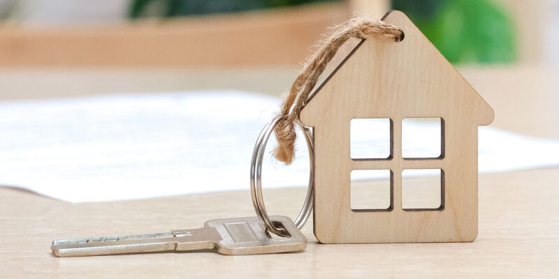 Toy house with house key attached