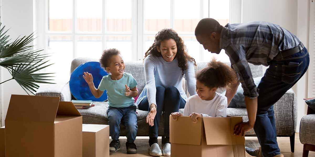 Family of color moving into a new home