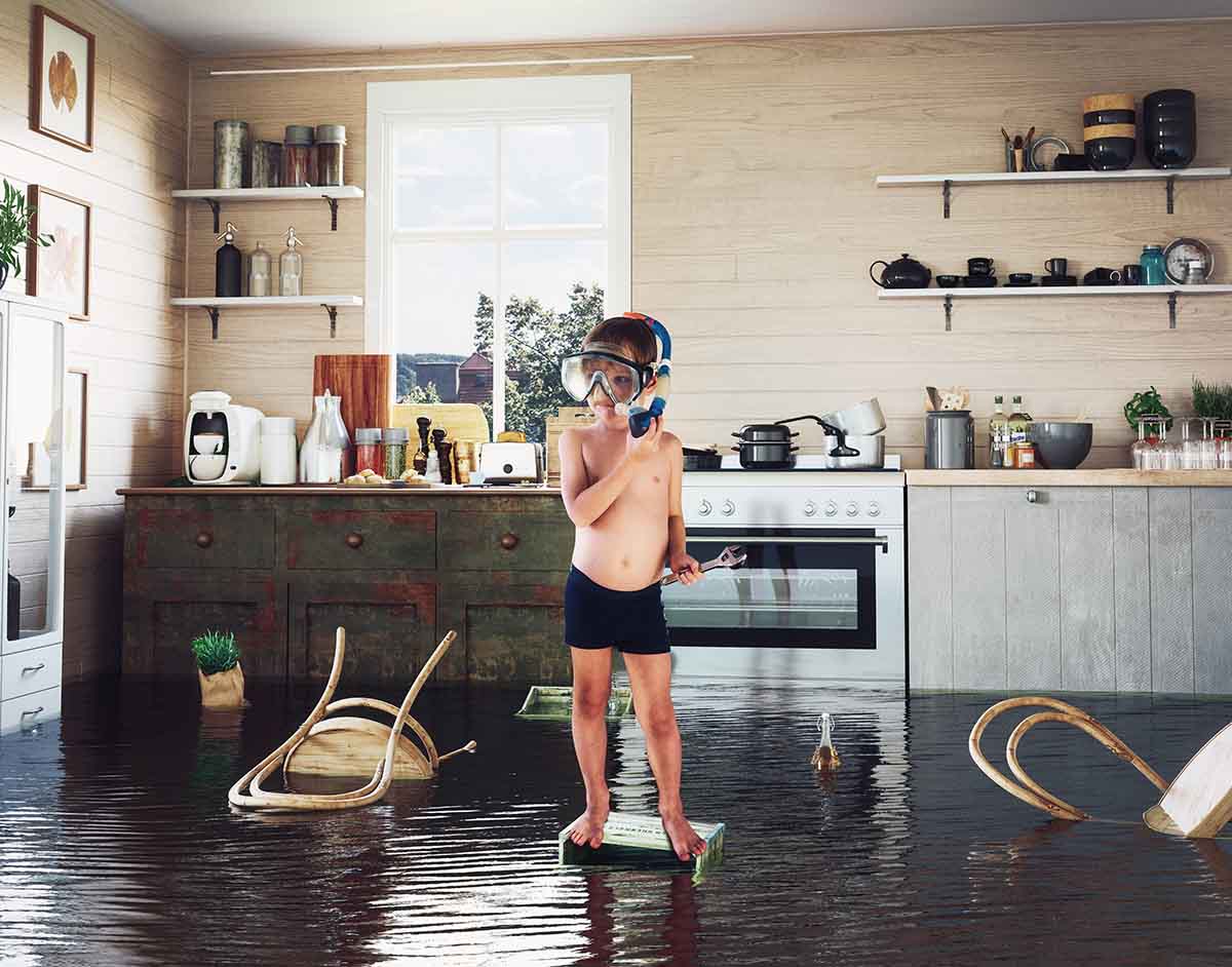 kid floating in flooded kitchen
