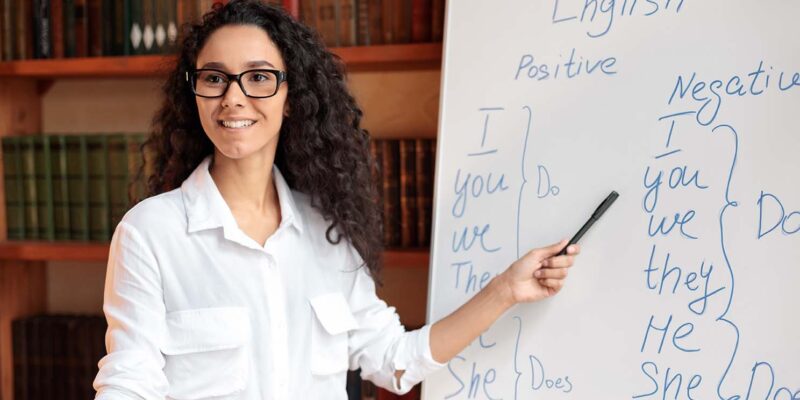 Teacher in front of whiteboard