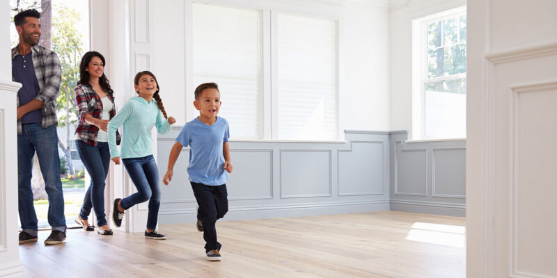 Latino family entering their new home