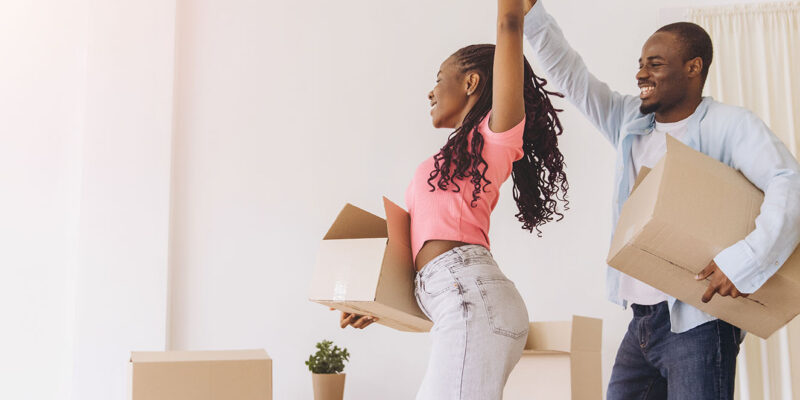 Couple dancing with moving boxes