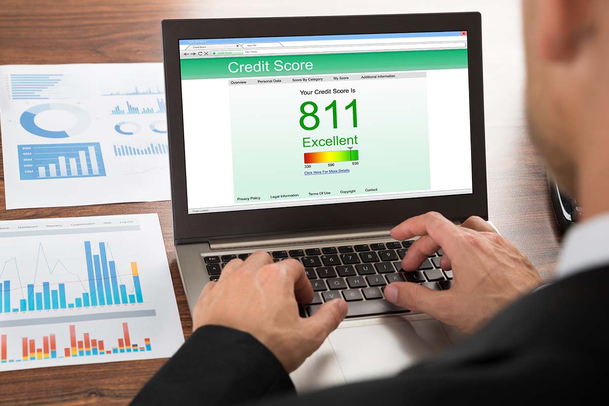 image of laptop with credit score