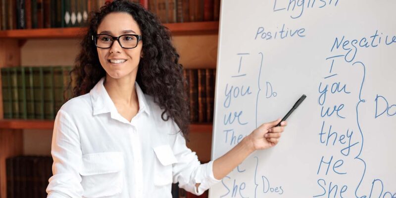 Teacher standing at white board