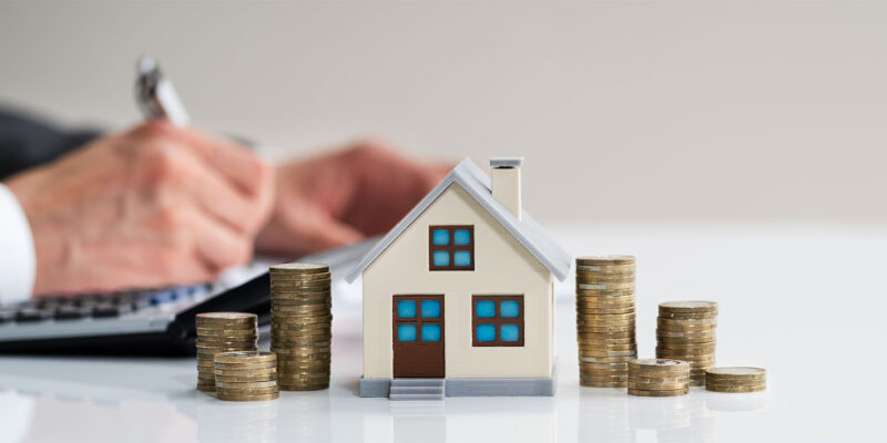 Toy house with coins