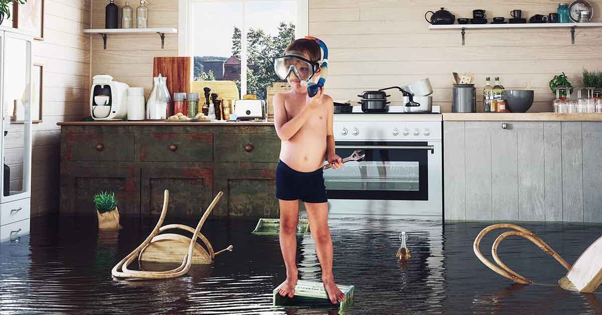 kid floating in flooded kitchen