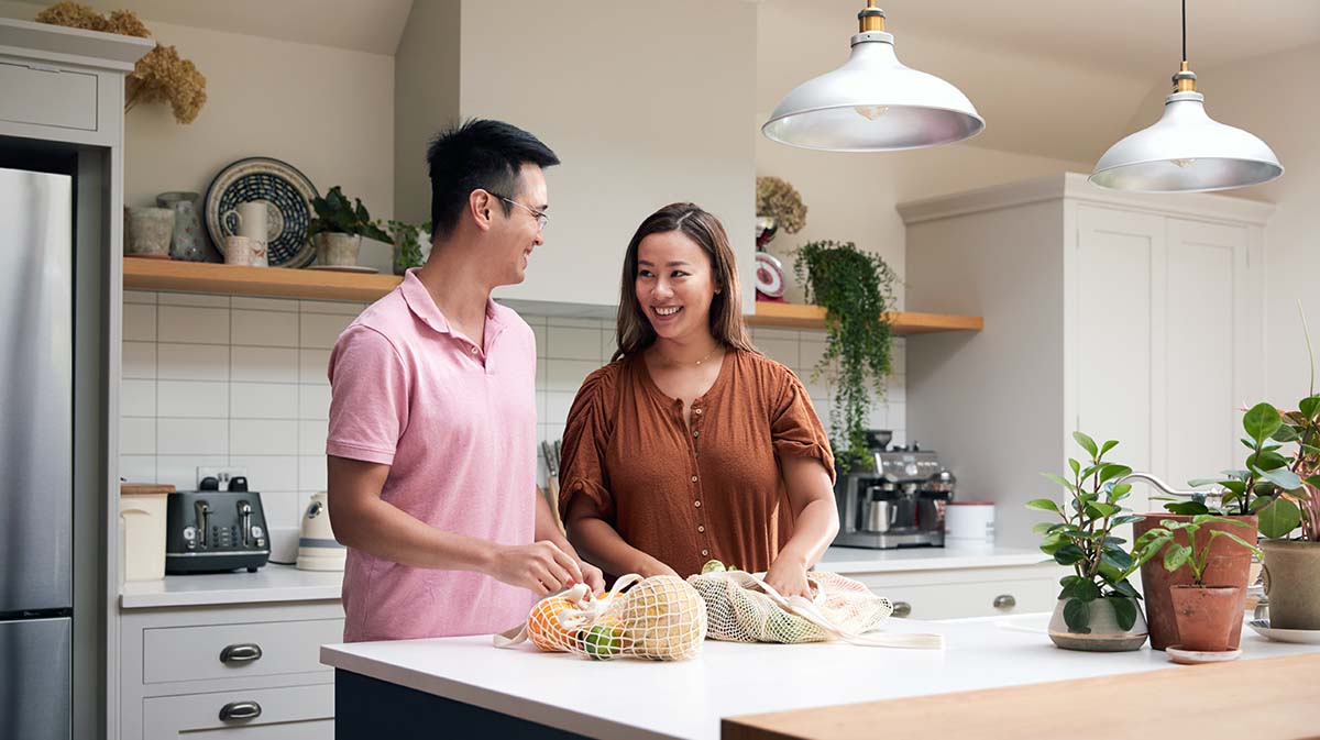 Asian couple cooking together
