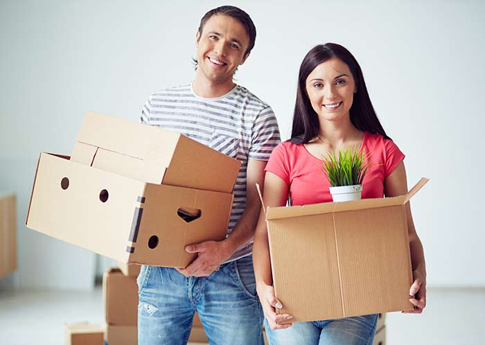young couple moving into house