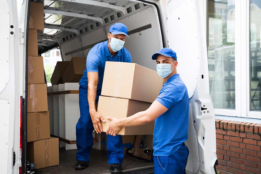 Moving van and 2 men with masks