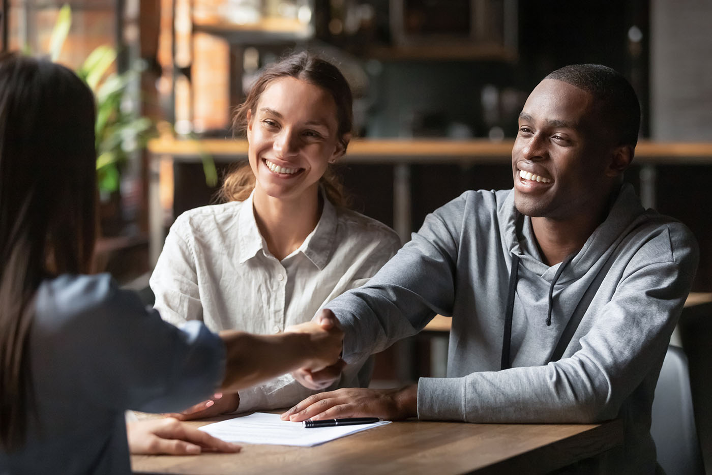 couple sitting with a loan officer