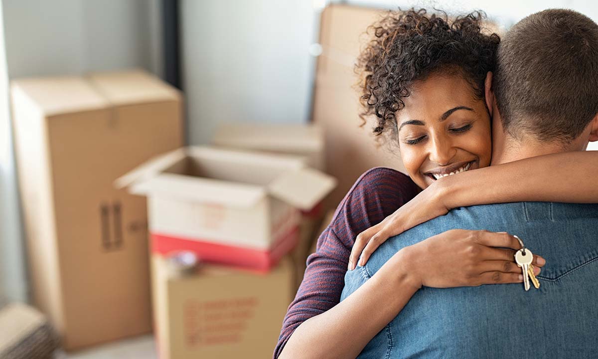 couple hugging in new home