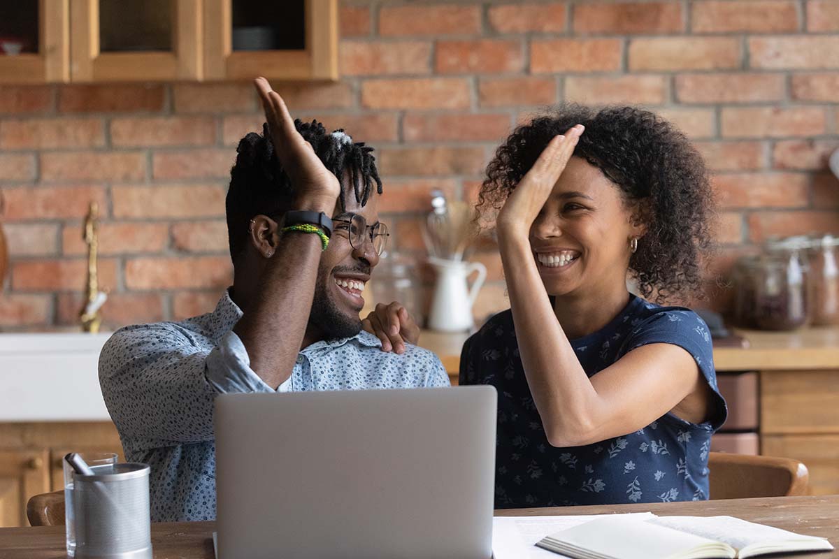 happy couple getting approval for a home loan based on rental payments