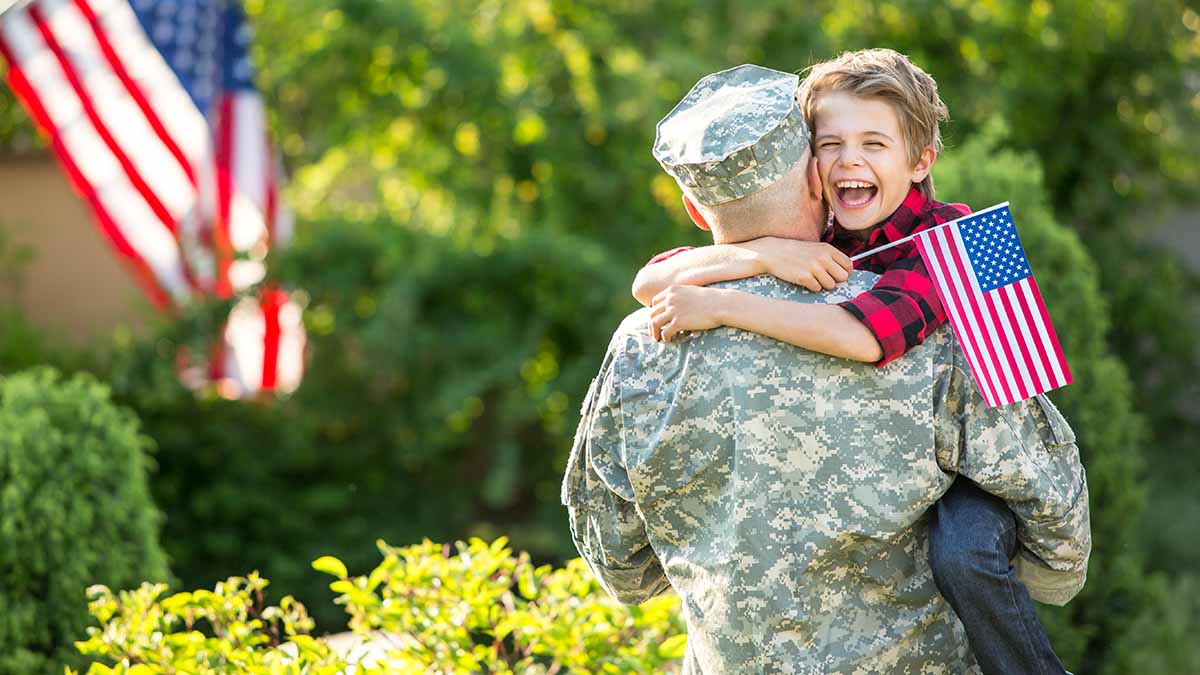 A soldier hugging his child