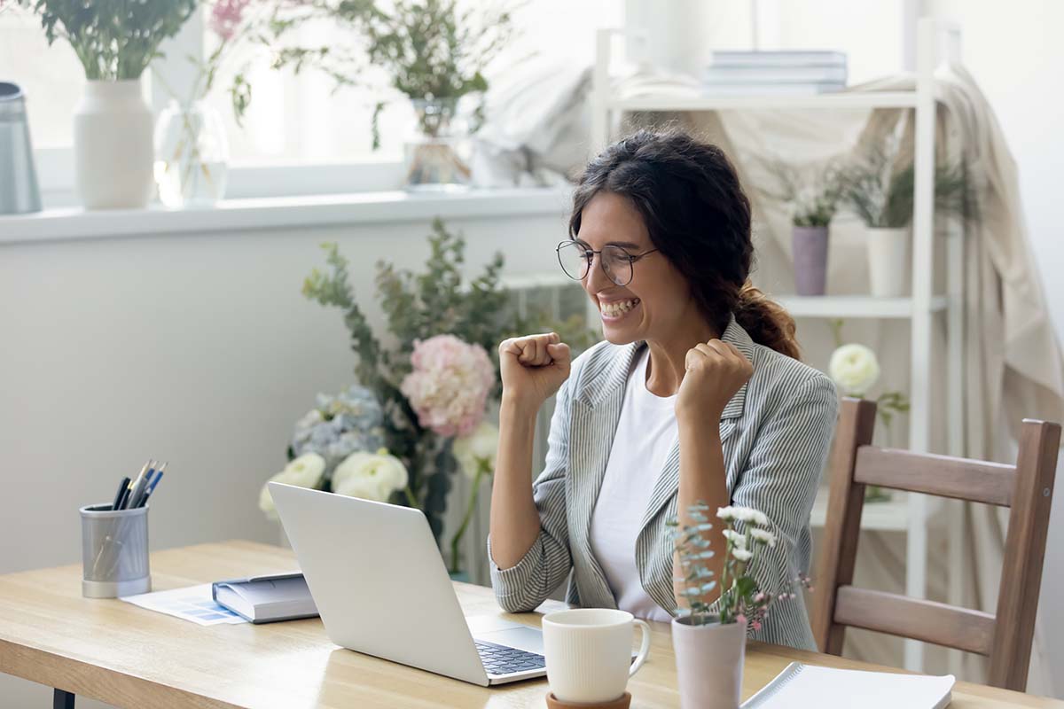 woman getting celebrating the cuts to mortgage insurance premiums