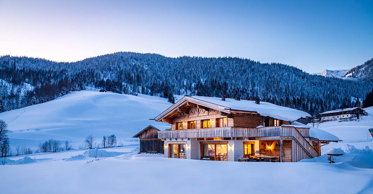 8 reasons to buy a home, picture of a log home in the snow